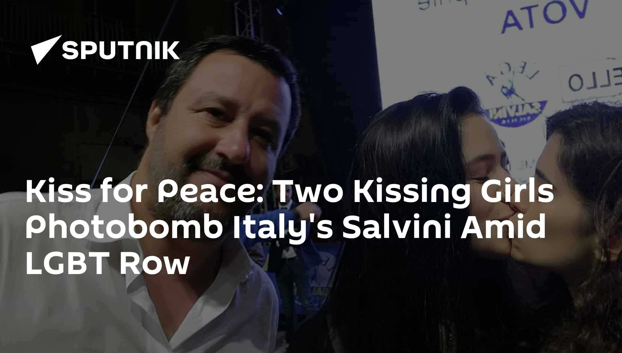 Kiss for Peace: Two Kissing Girls Photobomb Italy