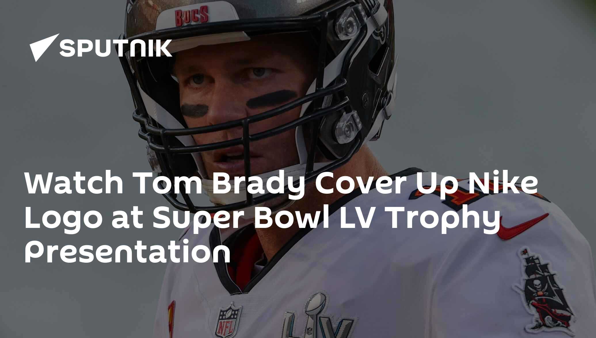 Tom Brady covers Nike logo during Super Bowl trophy presentation