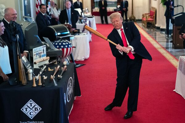 President Donald Trump swings a baseball bat during the Spirit of America Showcase at the White House, Thursday, 2 July 2020, in Washington. - Sputnik International