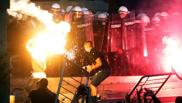 Protesters clash with police in Belgrade. Riots began engulfed Belgrade after the authorities announced the introduction of curfew from Friday to Monday due to the worsening coronavirus situation. - Sputnik International