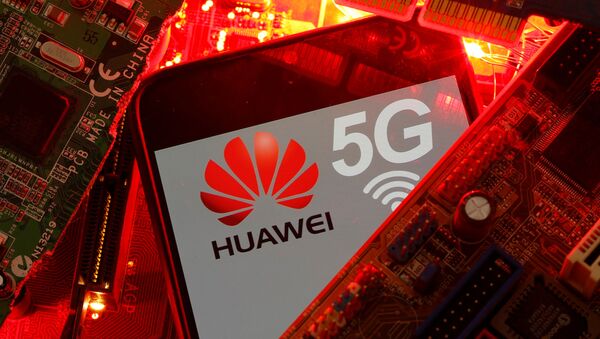 A smartphone with the Huawei and 5G network logo is seen on a PC motherboard in this illustration picture taken January 29, 2020 - Sputnik International