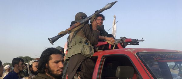 Taliban fighters ride in their vehicle in Surkhroad district of Nangarhar province, east of Kabul, Afghanistan, Saturday, June 16, 2018 Taliban fighters ride in their vehicle in Surkhroad district of Nangarhar province, east of Kabul, Afghanistan, Saturday, June 16, 2018 - Sputnik International
