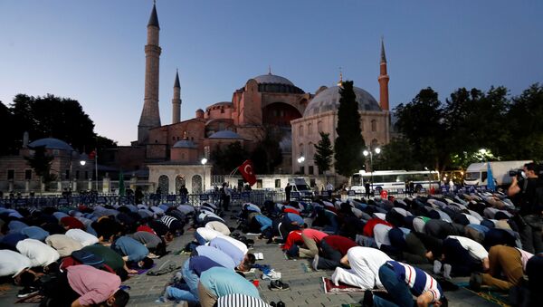 Muslims gather for evening prayers in front of the Hagia Sophia or Ayasofya, after a court decision that paves the way for it to be converted from a museum back into a mosque, in Istanbul, Turkey, July 10, 2020 - Sputnik International