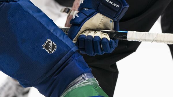 In this file photo taken on February 8, 2020 a player's glove and stick before a face-off during NHL action at Rogers Arena in Vancouver, Canada. - Sputnik International