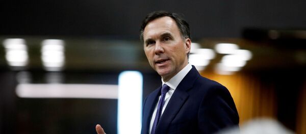 Canada's Minister of Finance Bill Morneau speaks in the House of Commons as legislators convene to give the government power to inject billions of dollars in emergency cash to help individuals and businesses through the economic crunch caused by the coronavirus disease (COVID-19) outbreak, on Parliament Hill in Ottawa, Ontario, Canada April 11, 2020. Canada's Minister of Finance Bill Morneau speaks in the House of Commons as legislators convene to give the government power to inject billions of dollars in emergency cash to help individuals and businesses through the economic crunch caused by the coronavirus disease (COVID-19) outbreak, on Parliament Hill in Ottawa, Ontario, Canada April 11, 2020. - Sputnik International