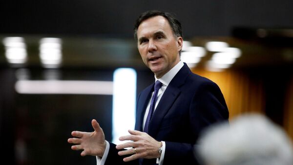 Canada's Minister of Finance Bill Morneau speaks in the House of Commons as legislators convene to give the government power to inject billions of dollars in emergency cash to help individuals and businesses through the economic crunch caused by the coronavirus disease (COVID-19) outbreak, on Parliament Hill in Ottawa, Ontario, Canada April 11, 2020. - Sputnik International
