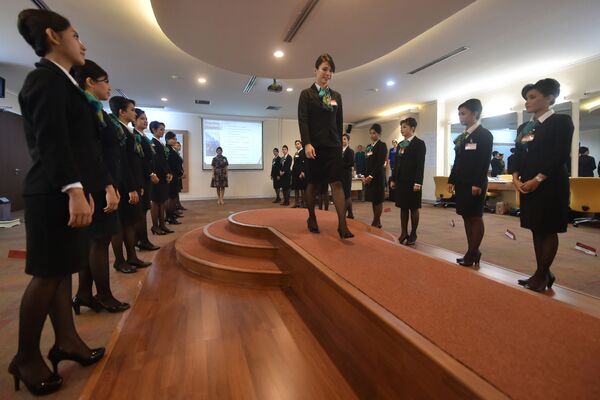 This photograph taken on October 14, 2016, shows flight staff practising walking techniques during a class at Garuda Indonesia's training centre in Jakarta - Sputnik International