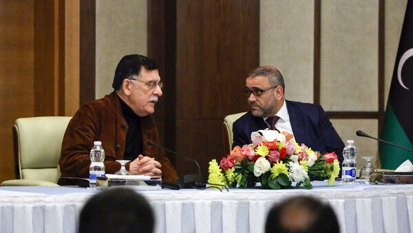 Fayez al-Sarraj (L), head of Libya's Government of National Accord (GNA), and Khalid al-Mishri, head of Libya's Supreme Council of State, attend a press conference in the capital Tripoli on January 15, 2020. - Sputnik International