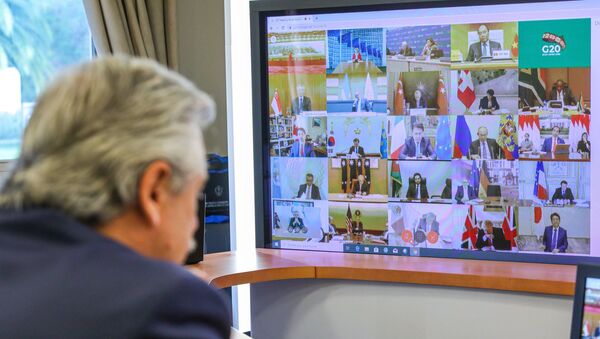 Handout photo released by Argentina's Presidency showing Argentine President Alberto Fernandez talking during the G20's video conference meeting at the Olivos Presidential residence in Buenos Aires outskirts, on March 26, 2020 - Sputnik International