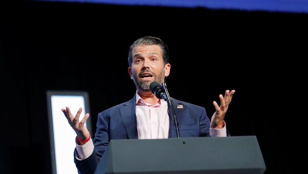 Donald Trump Jr. speaks to young people waiting to hear his father, U.S. President Donald Trump, deliver an Address to Young Americans at the Dream City Church in Phoenix, Arizona, U.S., June 23, 2020. - Sputnik International