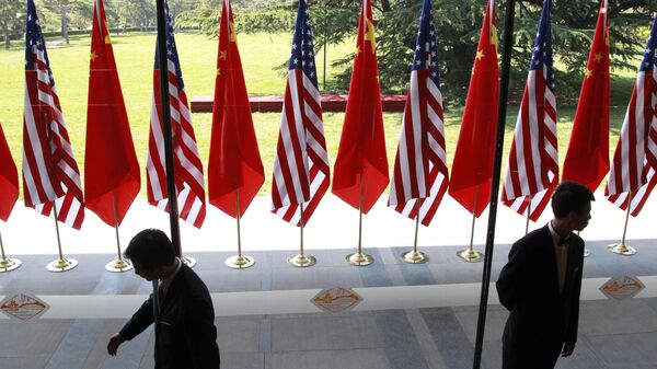 Chinese and US national flags are posted for the opening ceremony of the US-China Strategic and Economic Dialogue at The Diaoyutai state guesthouse in Beijing, Thursday, 3 May 2012 - Sputnik International
