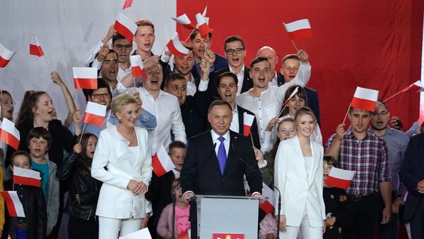 Polish President Andrzej Duda addresses supporters as exit poll results were announced during the presidential election in Pultusk, Poland, on July 12, 2020. - Poland's right-wing head of state Andrzej Duda was ahead by a tiny margin in the presidential run-off against Warsaw's liberal mayor, an exit poll on on July 12, 2020 showed, starting a tense wait for the official results  - Sputnik International