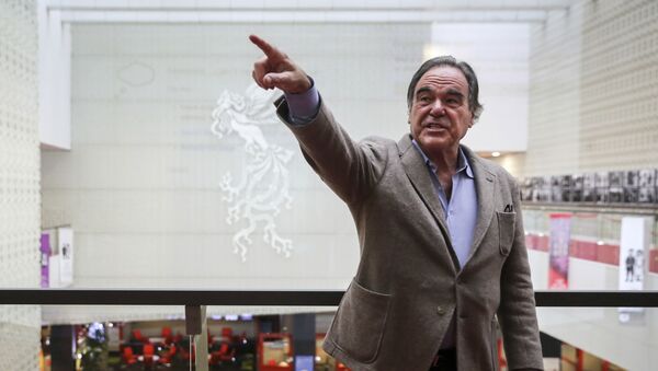 In this photo provided by Tasnim News Agency, American movie director Oliver Stone points in a photo opportunity while attending the Fajr International Film Festival, in Tehran, Iran, Monday, April 23, 2018 - Sputnik International