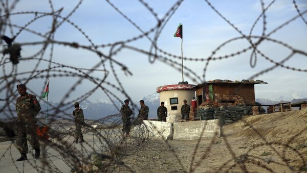 Afghan National Army soldiers stand guard at a checkpoint near the Bagram base in northern Kabul, Afghanistan, Wednesday, April 8, 2020 - Sputnik International
