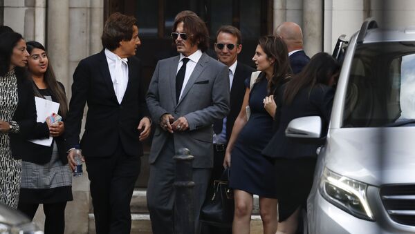Actor Johnny Depp, centre, leaves the High Court in London, Monday, 13 July 2020 - Sputnik International
