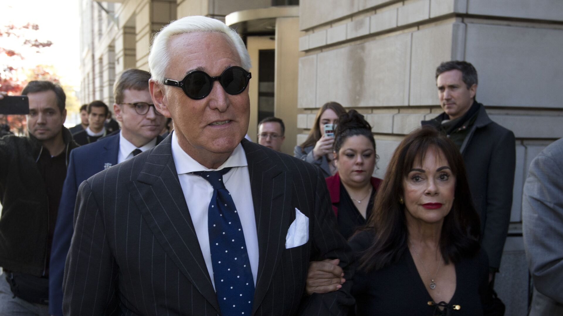In this Nov. 15, 2019, file photo, Roger Stone, left, with his wife Nydia Stone, leaves federal court in Washington, Friday, Nov. 15, 2019 - Sputnik International, 1920, 21.02.2021
