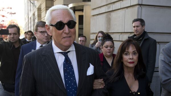 In this Nov. 15, 2019, file photo, Roger Stone, left, with his wife Nydia Stone, leaves federal court in Washington, Friday, Nov. 15, 2019 - Sputnik International
