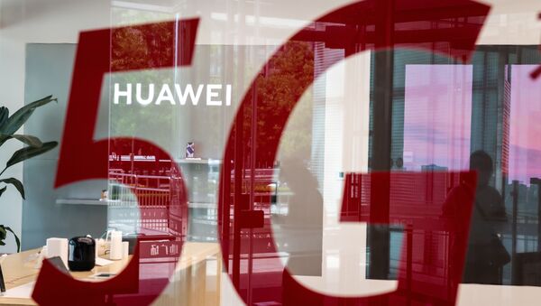 (FILES) This file photo taken on May 25, 2020, shop for Chinese telecom giant Huawei features a red sticker reading 5G in Beijing on May 25, 2020 - Sputnik International