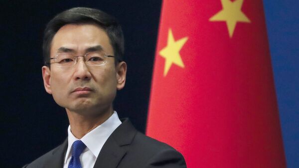 In this March 18, 2020, file photo, Chinese Foreign Ministry spokesman Geng Shuang listens to a question during a daily briefing at the Ministry of Foreign Affairs office in Beijing. Lawsuits are starting to pile up around the U.S. seeking to hold China accountable for the coronavirus pandemic - Sputnik International