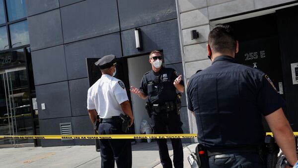 NYPD officers speak at crime scene at 265 Houston Street, where Fahim Saleh, Co-founder/CEO of Gokada, was found dead at the apartment building in New York City, New York, U.S., July 15, 2020. - Sputnik International