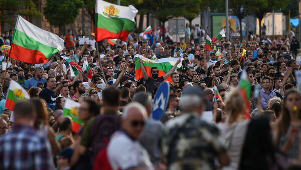 Protestors shout slogans and wave Bulgarian national flags during an anti-government protest in Sofia, on July 11, 2020.  - Sputnik International