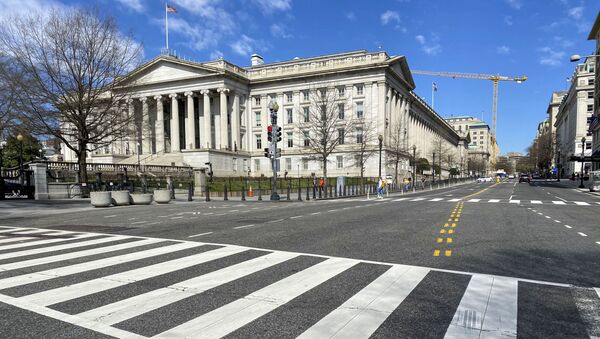 In this file photo taken on March 13, 2020 the US Treasury Department building is seen next to an almost empty 15th Street at noon in Washington DC. - Sputnik International