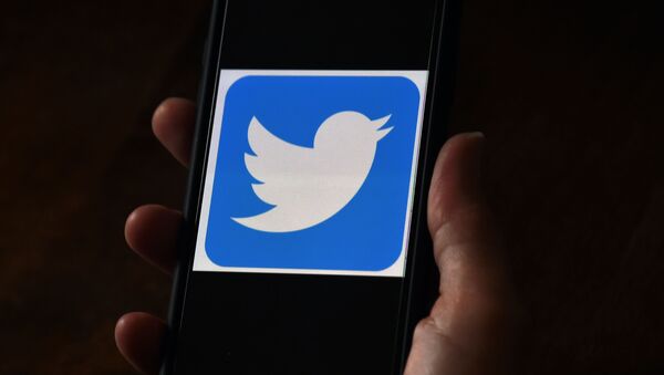 (FILES) In this file photo taken on May 27, 2020 ,In this photo illustration, a Twitter logo is displayed on a mobile phone in Arlington, Virginia - Sputnik International