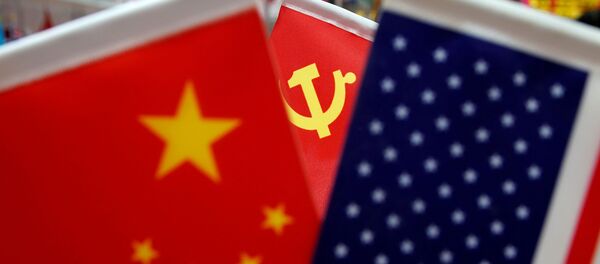 The flags of China, U.S. and the Chinese Communist Party are displayed in a flag stall at the Yiwu Wholesale Market in Yiwu, Zhejiang province, China, May 10, 2019. - Sputnik International