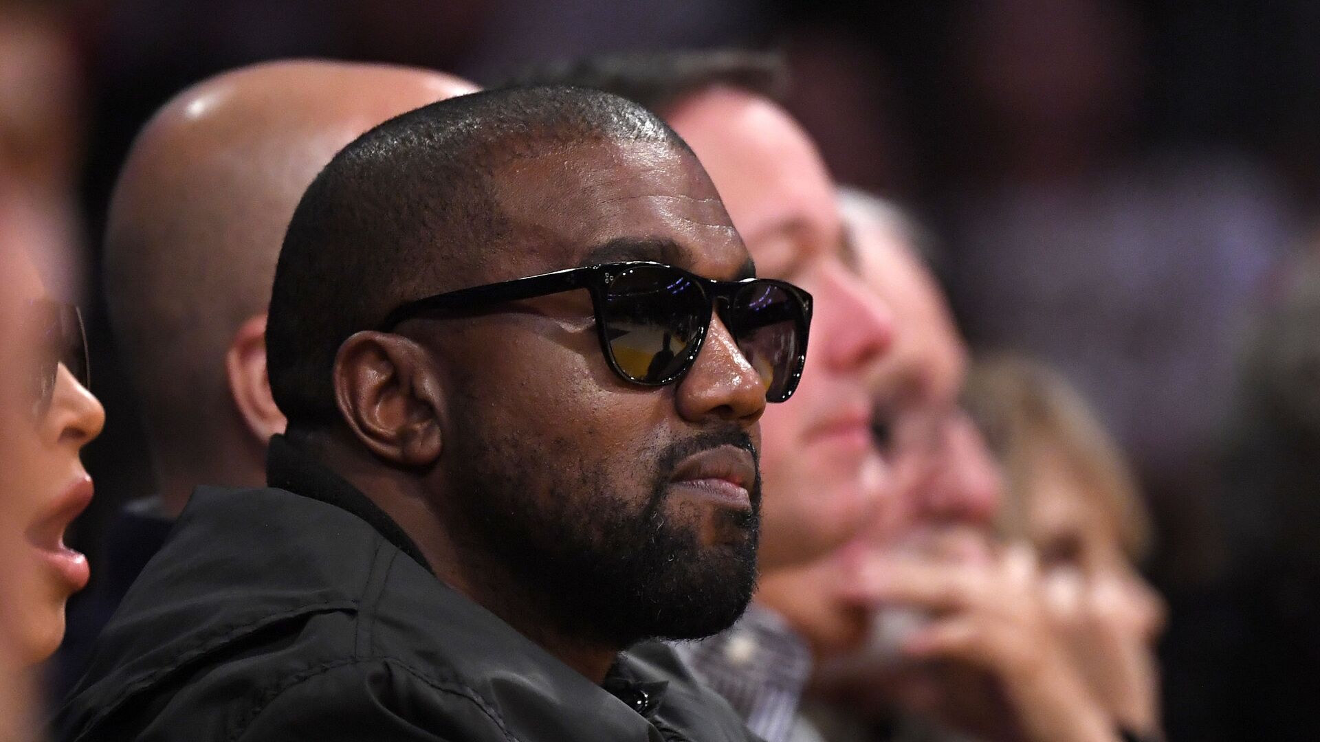 In this Jan. 13, 2020 file photo, Rapper Kanye West watches during the second half of an NBA basketball game between the Los Angeles Lakers and the Cleveland Cavaliers in Los Angeles. Drawings by West from when the rapper was a high school student in Chicago are now worth thousands of dollars, according to an appraiser. - Sputnik International, 1920, 17.03.2022