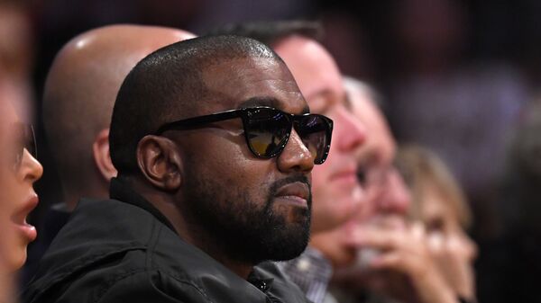 In this Jan. 13, 2020 file photo, Rapper Kanye West watches during the second half of an NBA basketball game between the Los Angeles Lakers and the Cleveland Cavaliers in Los Angeles. Drawings by West from when the rapper was a high school student in Chicago are now worth thousands of dollars, according to an appraiser. - Sputnik International