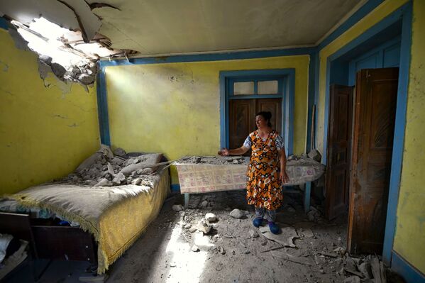 A local woman shows damage in her house after shelling by Armenian forces in the Tovuz region of Azerbaijan, Tuesday, July 14, 2020 - Sputnik International