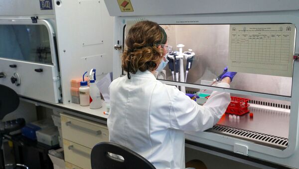 A scientist works during the visit of Britain's William, Duke of Cambridge, to the manufacturing laboratory where a vaccine against the coronavirus disease (COVID-19) has been produced at the Oxford Vaccine Group's facility at the Churchill Hospital in Oxford, Britain, June 24, 2020. - Sputnik International