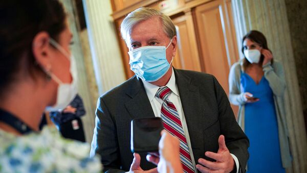 U.S. Sen. Lindsey Graham (R-S.C.) speaks with a reporter as he arrives for a vote to close debate on the motion to proceed to consideration of the National Defense Authorization Act in the U.S. Capitol in Washington, U.S., June 25, 2020. - Sputnik International
