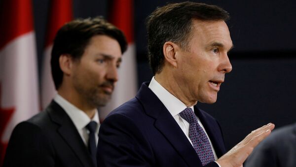 Canada's Minister of Finance Bill Morneau attends a news conference with Prime Minister Justin Trudeau in Ottawa, Ontario, Canada March 11, 2020. - Sputnik International