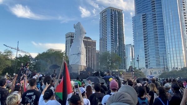Protesters surround a statue of Christopher Columbus at Grant Park in Chicago, Illinois, U.S., July 17, 2020, in this still image from video obtained via social media - Sputnik International
