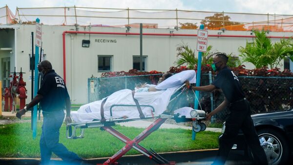 Emergency Medical Technicians (EMT) leave with a patient at North Shore Medical Center where the coronavirus disease (COVID-19) patients are treated, in Miami, Florida, U.S. July 14, 2020. - Sputnik International
