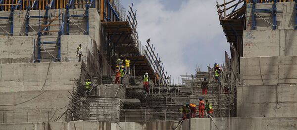 Ethiopian workers construct on March 31, 2015 the Grand Renaissance Dam near the Sudanese-Ethiopian border Ethiopian workers construct on March 31, 2015 the Grand Renaissance Dam near the Sudanese-Ethiopian border - Sputnik International