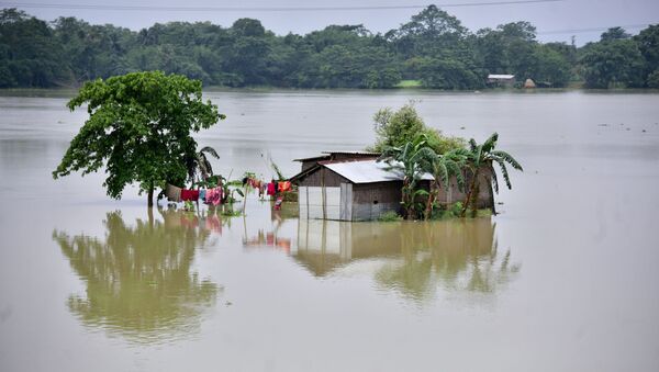 A partially submerged house is seen at the flood-affected Mayong village in Morigaon district, in the northeastern state of Assam, India, June 29, 2020 - Sputnik International