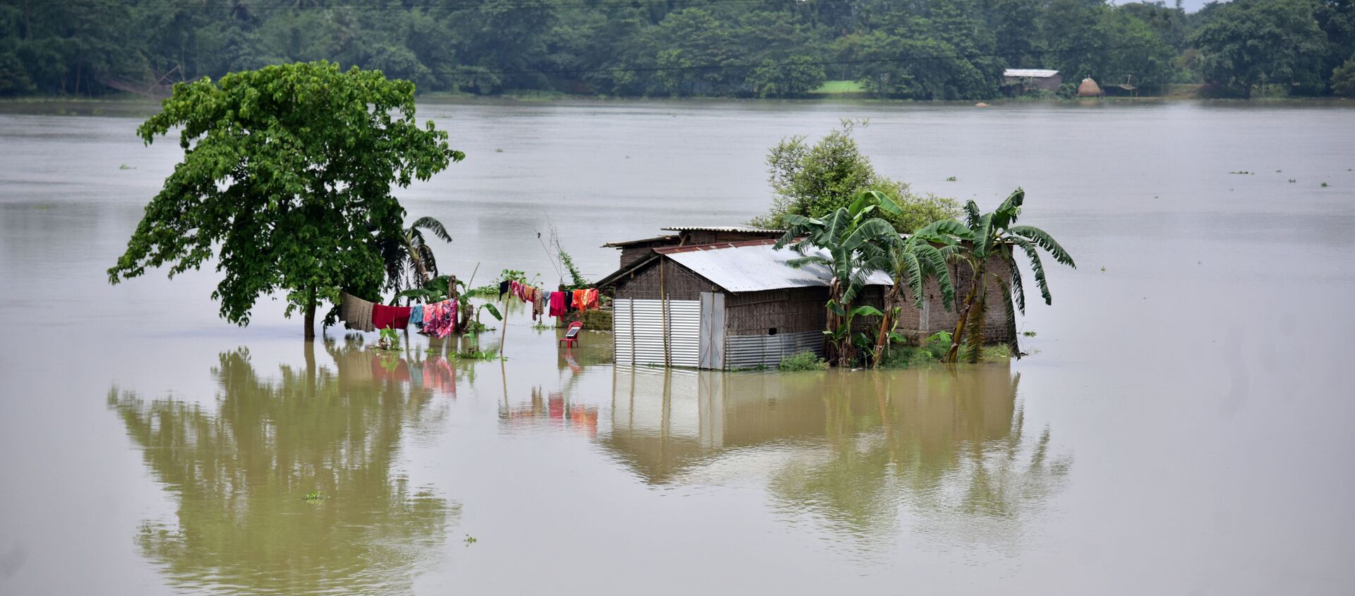 A partially submerged house is seen at the flood-affected Mayong village in Morigaon district, in the northeastern state of Assam, India, June 29, 2020 - Sputnik International, 1920, 20.07.2020