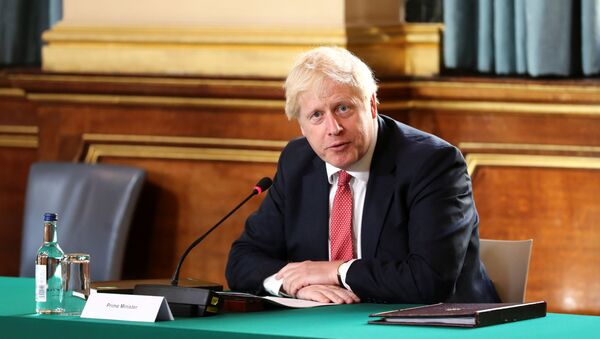 Britain's Prime Minister Boris Johnson speaks during a face-to-face meeting of his cabinet team of ministers, the first since mid-March because of the coronavirus disease (COVID-19) pandemic, at the Foreign and Commonwealth Office in London, Britain, July 21, 2020 - Sputnik International