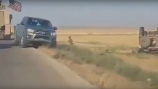 Footage of the scene of an accident involving a coalition vehicle in which one US servicemember was killed. July 21, 2020. - Sputnik International