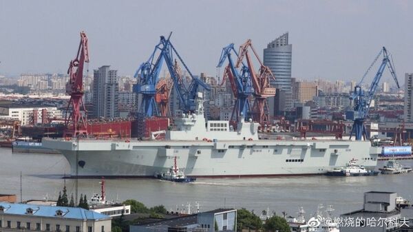 China's Type 075 landing helicopter dock (LHD), an aircraft carrier that carries amphibious assault forces, docked in Shanghai - Sputnik International