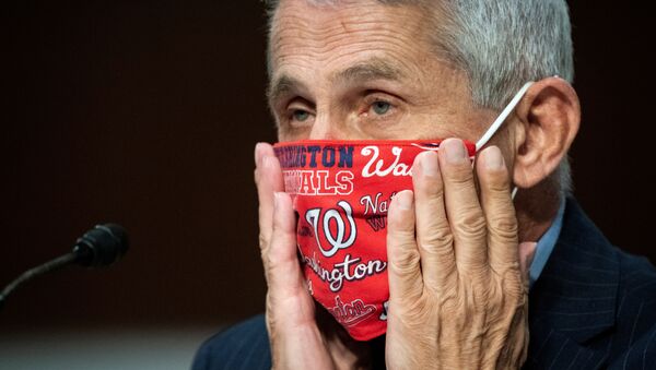 Anthony Fauci, director of the National Institute of Allergy and Infectious Diseases, adjusts his face mask during a Senate Health, Education, Labor and Pensions Committee hearing on efforts to get back to work and school during the coronavirus disease (COVID-19) outbreak, in Washington, 30 June 2020 - Sputnik International