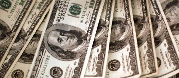 Four thousand U.S. dollars are counted out by a banker counting currency at a bank in Westminster, Colorado November 3, 2009 Four thousand U.S. dollars are counted out by a banker counting currency at a bank in Westminster, Colorado November 3, 2009 - Sputnik International