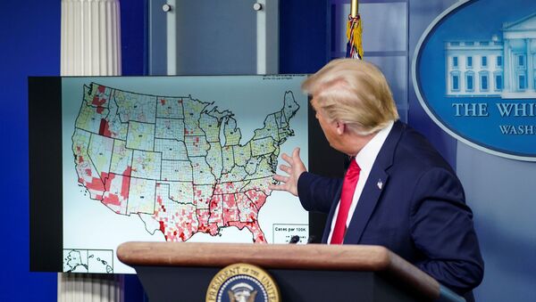 U.S. President Donald Trump points to a U.S. map of reported coronavirus cases as he speaks about reopening schools during a coronavirus disease (COVID-19) news briefing at the White House in Washington, U.S., July 23, 2020. - Sputnik International