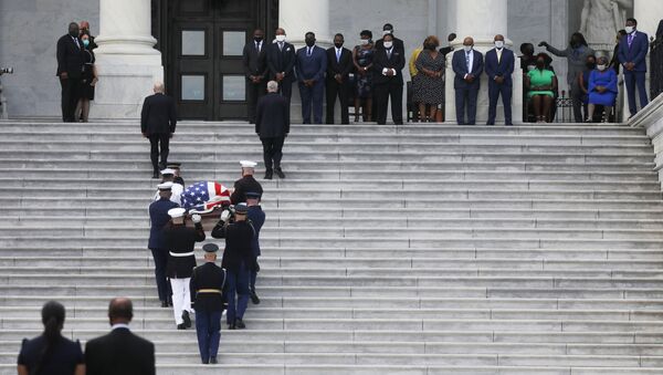 A U.S. military honor guard carries the casket of civil rights pioneer and longtime U.S. Rep. John Lewis (D-GA), who died July 17, up the steps of the U.S. Capitol to lie in state inside the Rotunda in Washington, U.S., July 27, 2020. - Sputnik International