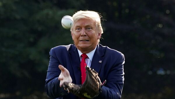 U.S. President Donald Trump catches a ball while hosting youth baseball players at the White House on opening day for Major League Baseball, in Washington, U.S., July 23, 2020 - Sputnik International