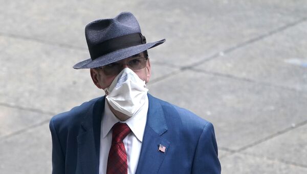 A man dressed in business attire wears a protective mask, following the outbreak of coronavirus disease (COVID-19) in the Manhattan borough of New York City, New York, U.S., July 23, 2020. - Sputnik International