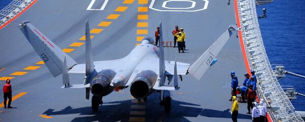 A J-15 fighter jet sits on the flight deck of the aircraft carrier Liaoning (Hull 16) A J-15 fighter jet sits on the flight deck of the aircraft carrier Liaoning (Hull 16) - Sputnik International