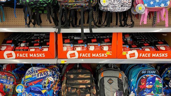Face masks are shown for sale with back packs and back to school supplies at a Walmart store during the outbreak of the coronavirus disease (COVID-19) in Encinitas, California, U.S., July 28, 2020 - Sputnik International